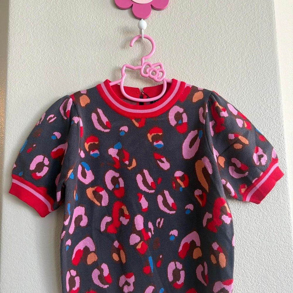 Multi-colored leopard print sweater with red trim Size Small